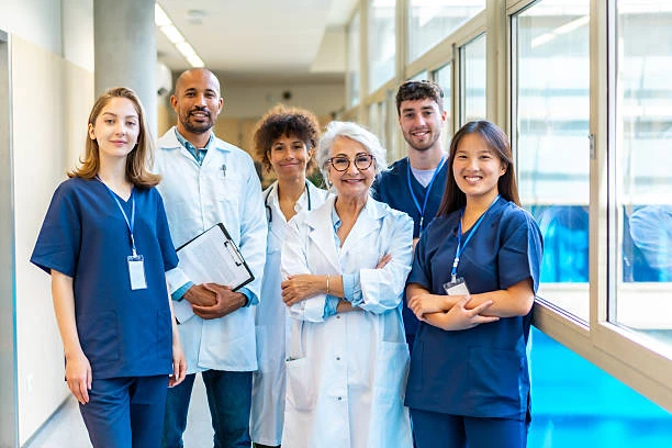 Healthcare team of doctors and nurses in a modern hospital corridor